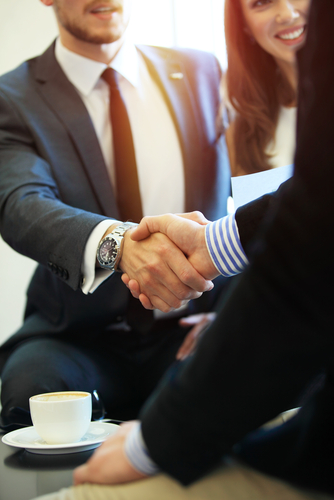 A handshake in a business meeting